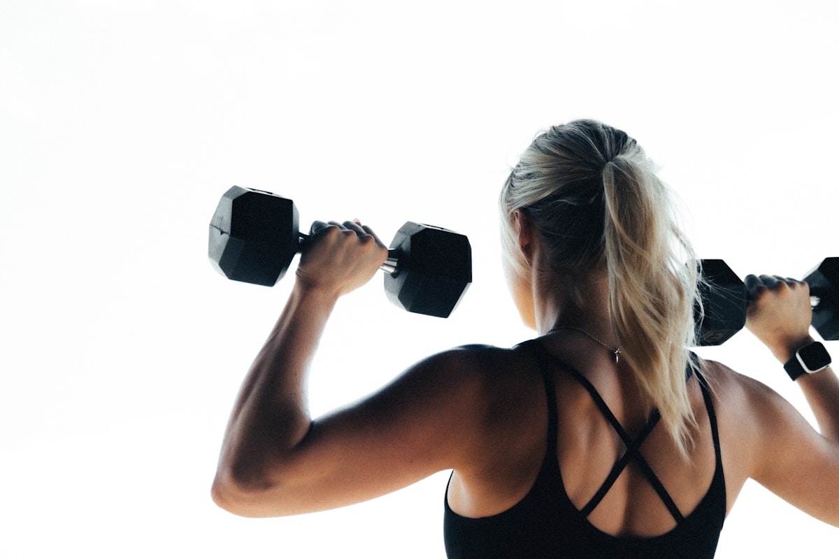 Professional fitness trainer demonstrating proper form